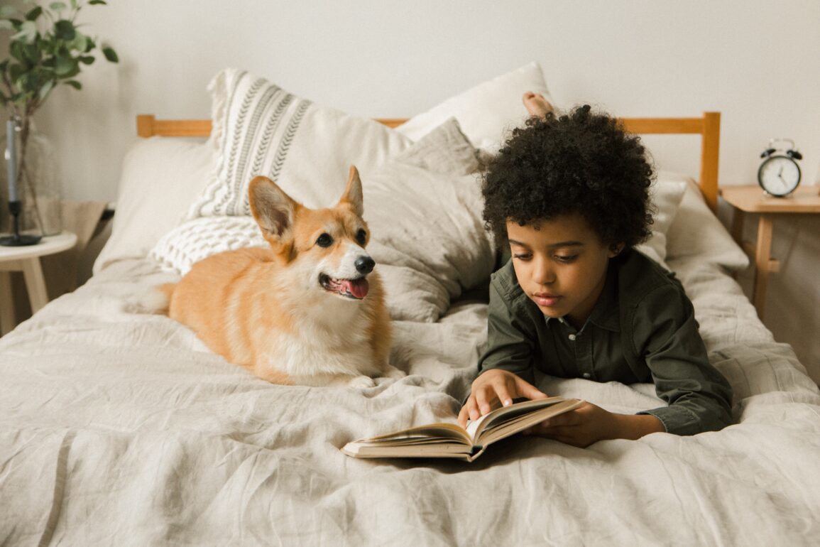 kid reading to his dog